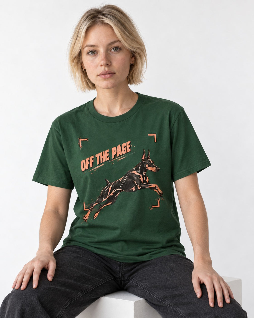 Doberman Off the Page Focus Frame Graphic T-Shirt in Forest Green, worn by a seated model