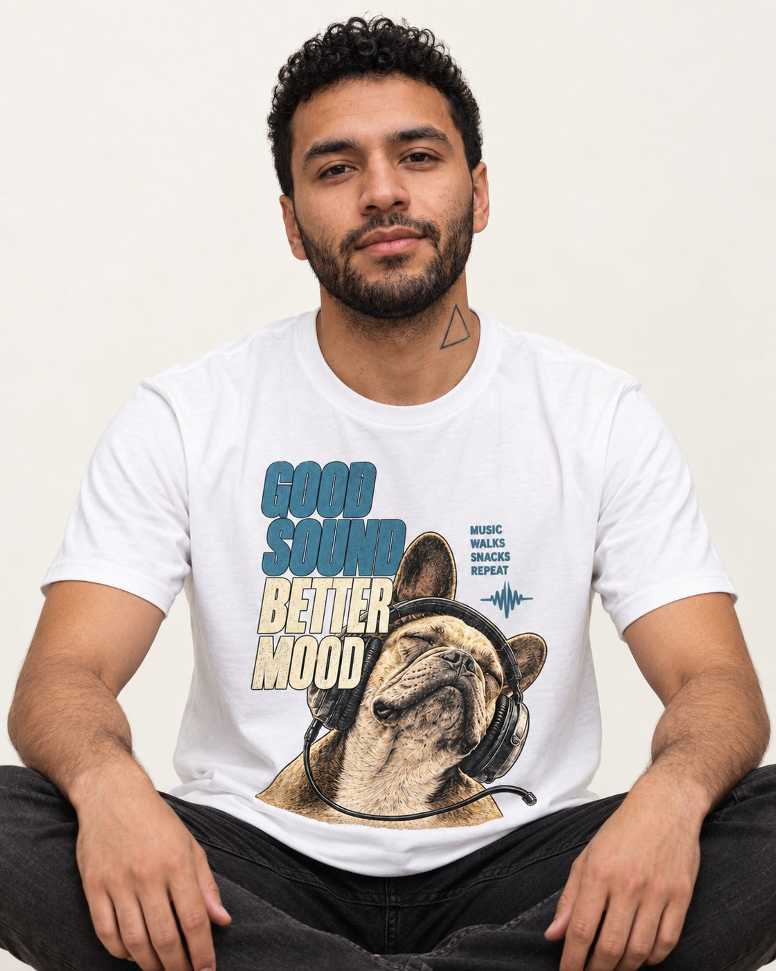 Frenchie Good Sound Better Mood Headphones Graphic T-Shirt in White, worn by a seated model
