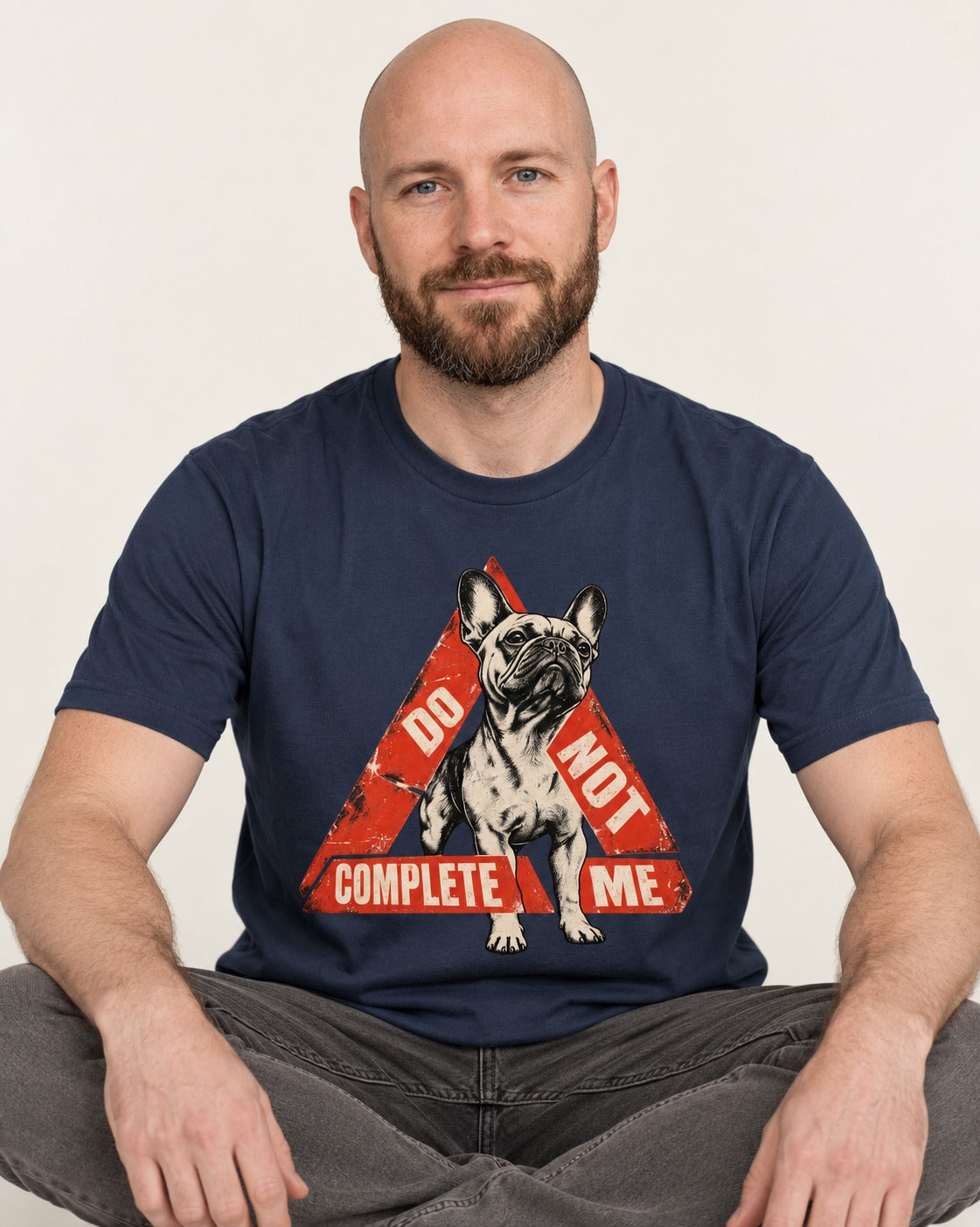 Frenchie Do Not Complete Me Warning Triangle Graphic T-Shirt in Navy, worn by a seated model