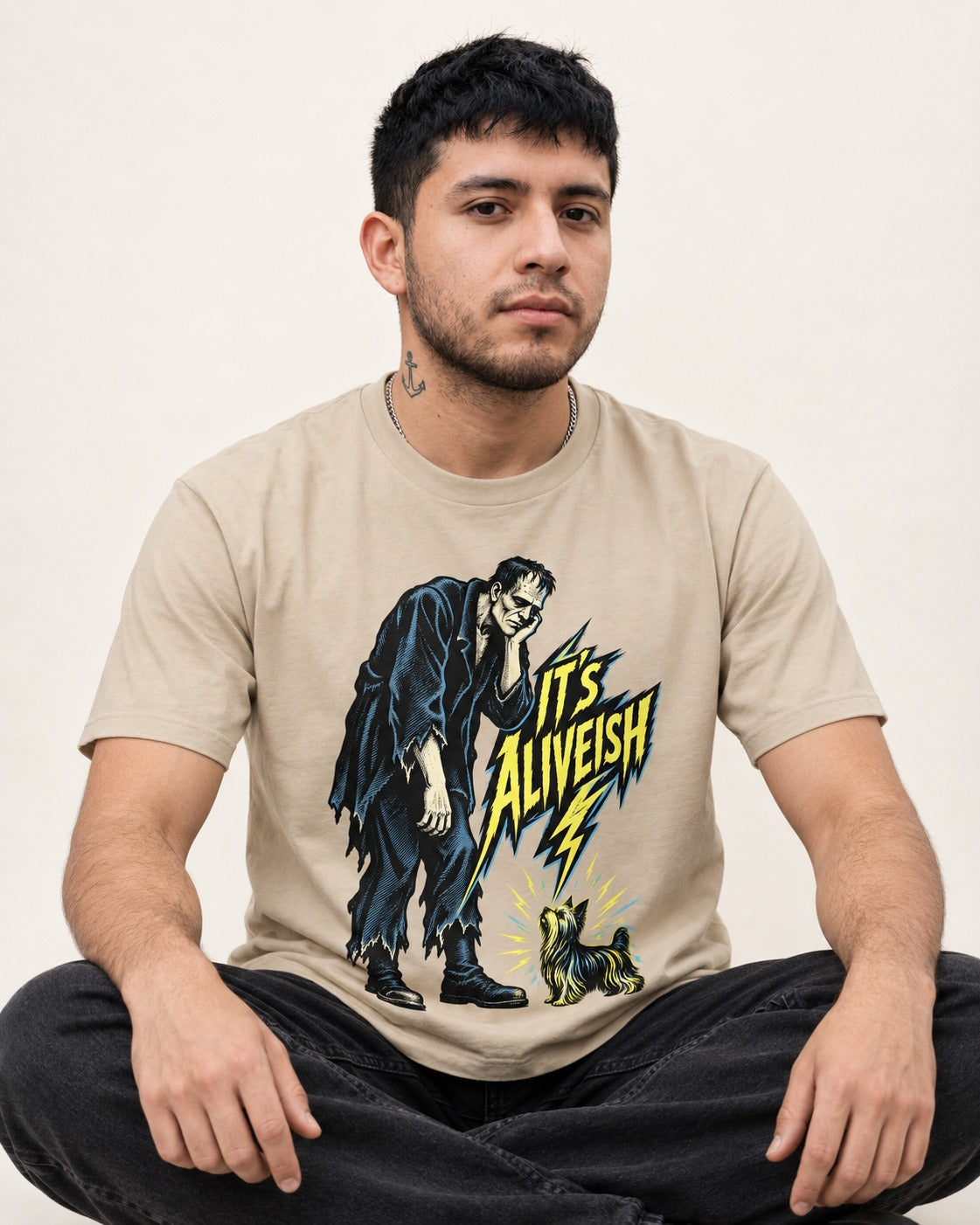 It's Aliveish Yorkshire Terrier T-Shirt in Sand, worn by a seated model