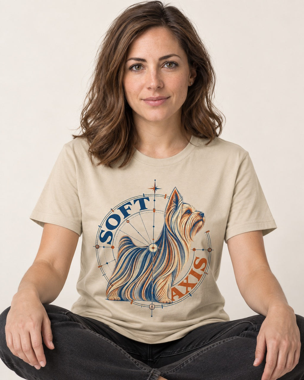 Soft Axis Yorkshire Terrier T-Shirt in Sand, worn by a seated model