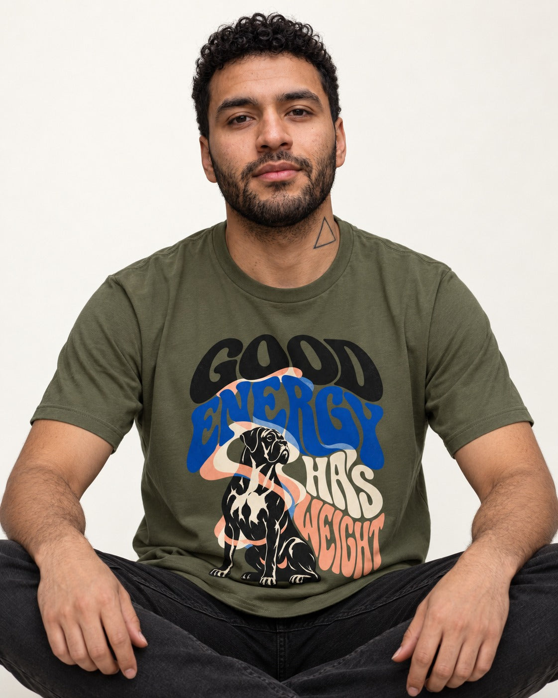 Good Energy Has Weight Boxer Retro Typography T-Shirt in Heather Military Green, worn by a seated model