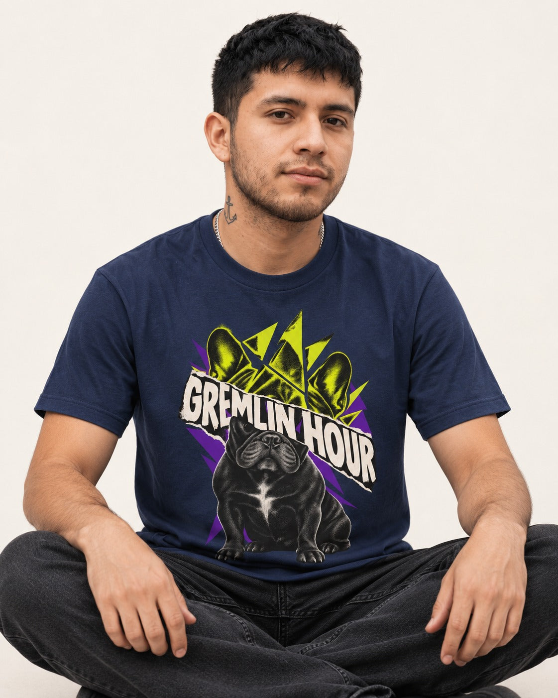 Frenchie Gremlin Hour Fracture Portrait Graphic T-Shirt in Navy, worn by a seated model