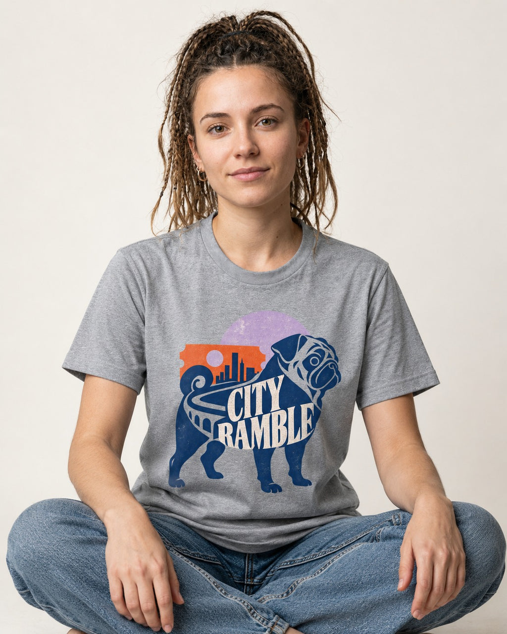 Pug's Big City Ramble T-Shirt in Sport Grey, worn by a seated model