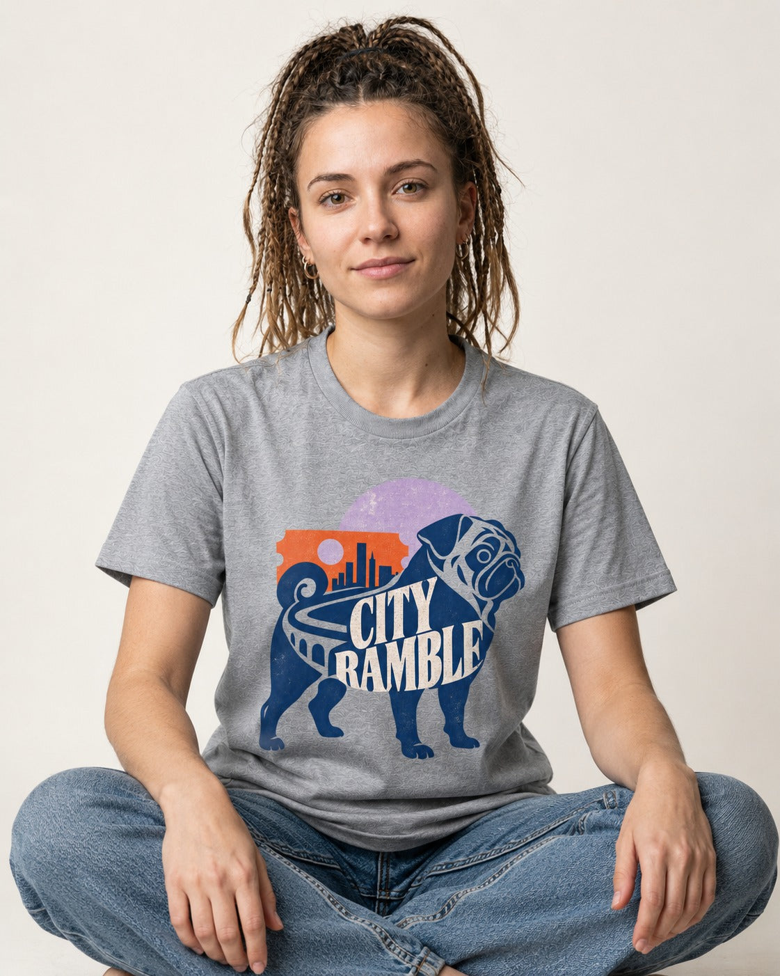 Pug's Big City Ramble T-Shirt in Sport Grey, worn by a seated model