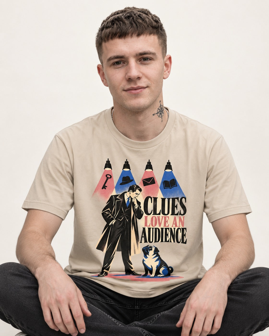 Pug Clues Love an Audience T-Shirt in Sand, worn by a seated model
