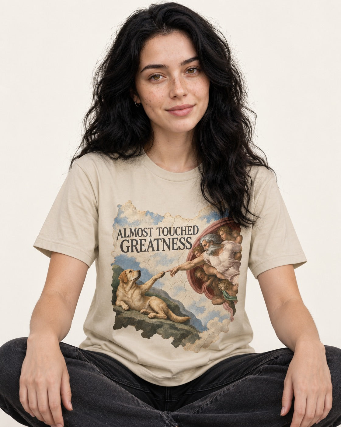 Labrador Retriever Almost Touched Greatness T-Shirt in Sand, worn by a seated model