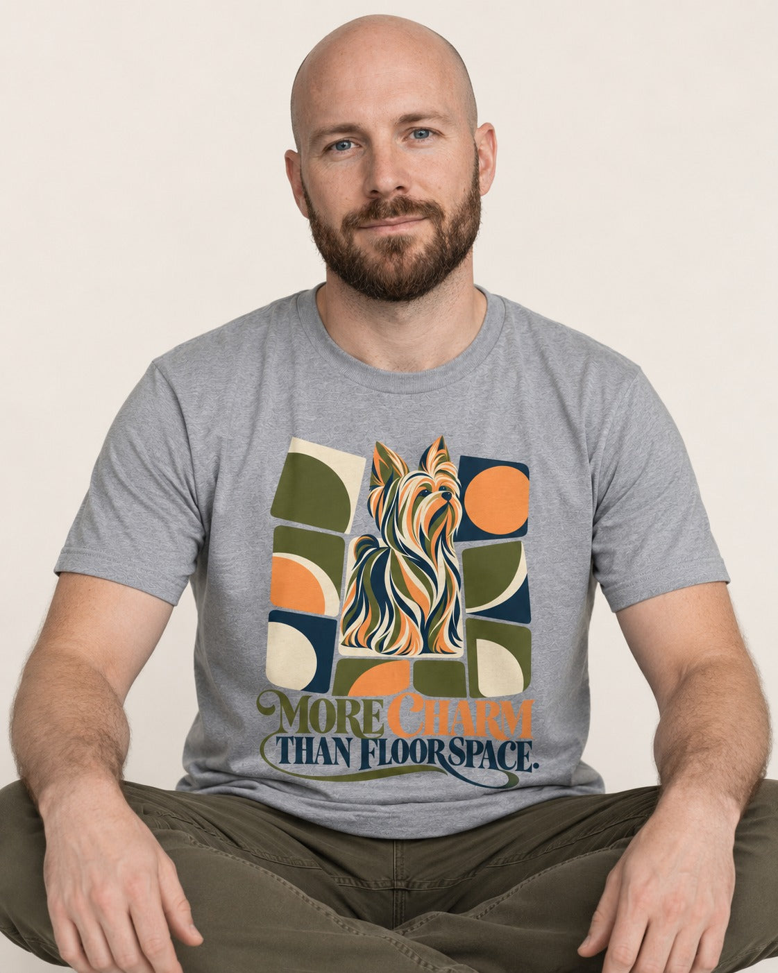 Yorkshire Terrier More Charm Than Space T-Shirt in Sport Grey, worn by a seated model