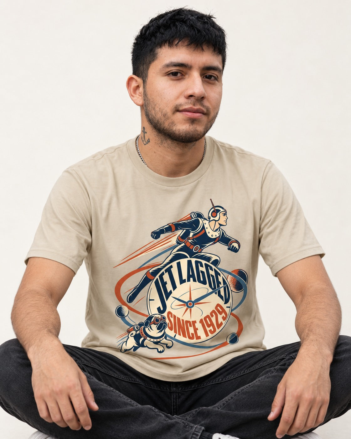 Jet Lagged Pug T-Shirt in Sand, worn by a seated model