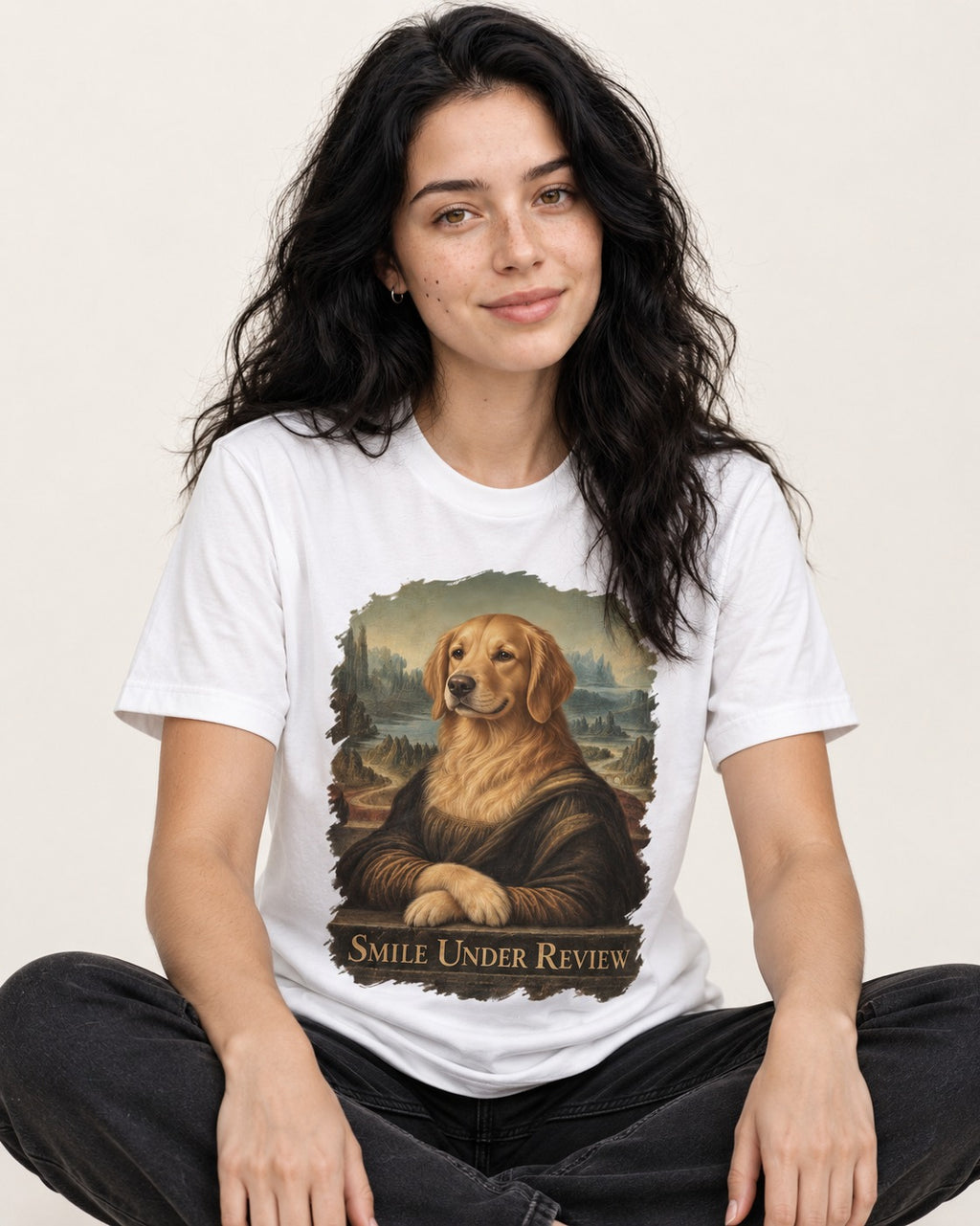 Smile Under Review Renaissance Portrait Golden Retriever Graphic T-Shirt in White, worn by a seated model