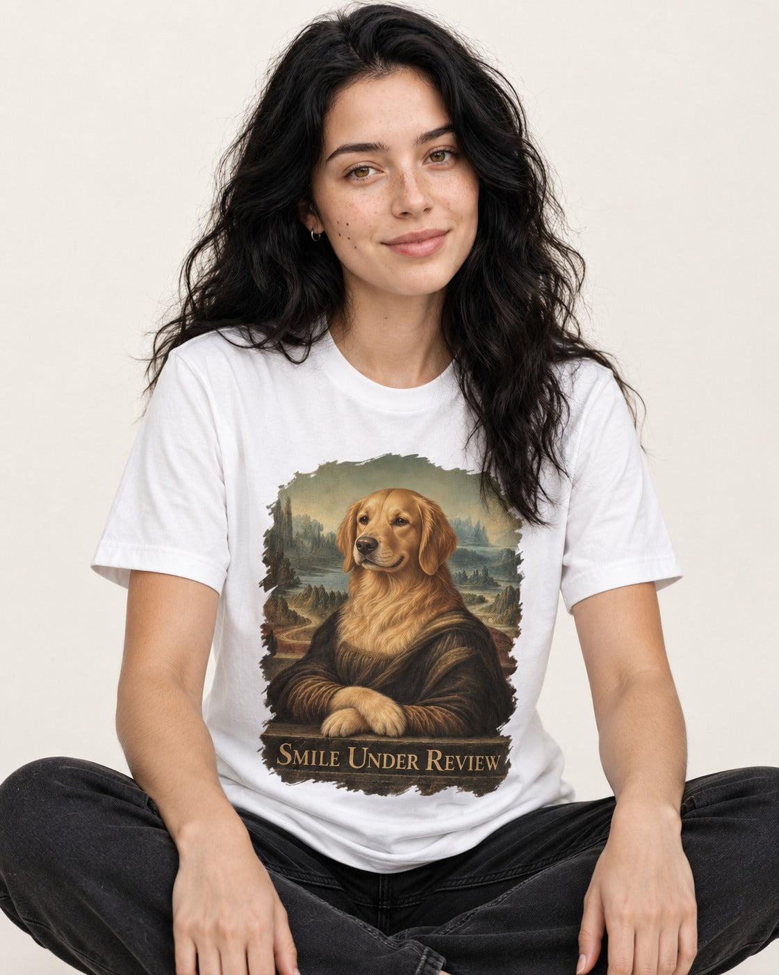 Smile Under Review Renaissance Portrait Golden Retriever Graphic T-Shirt in White, worn by a seated model