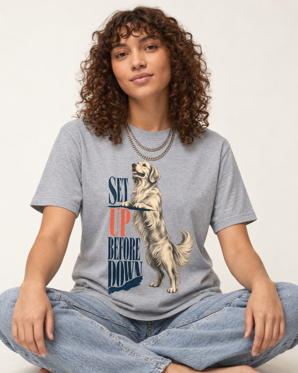 Golden Retriever Set Up Before Down T-Shirt in Sport Grey, worn by a seated model