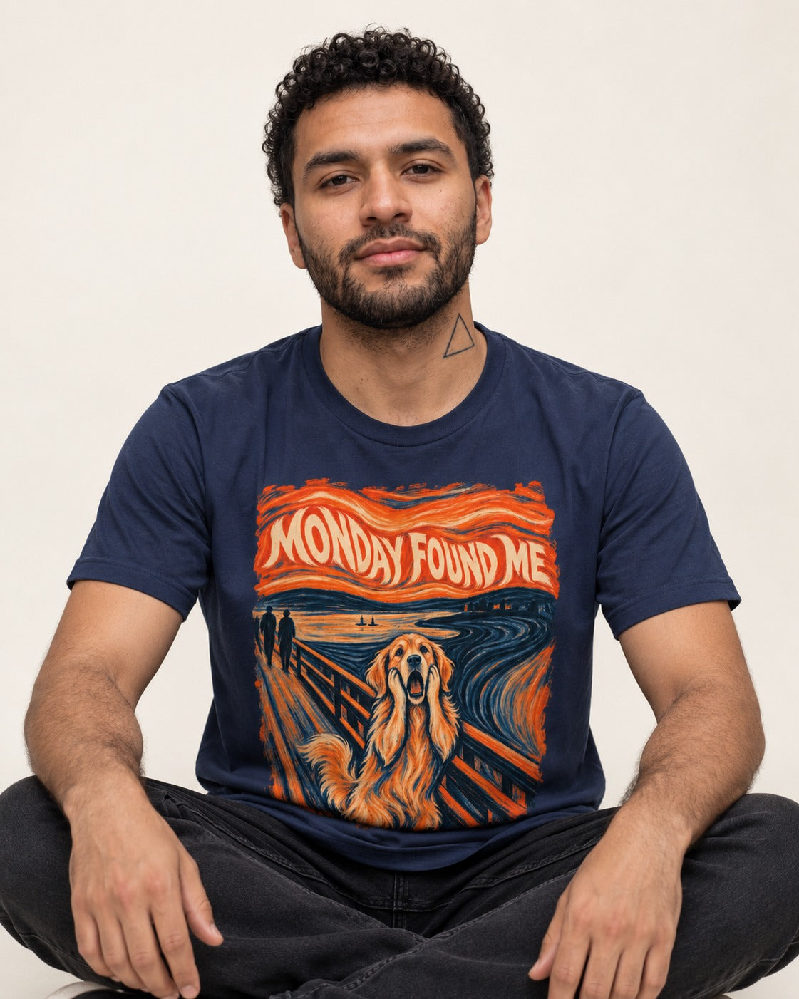 Monday Found Me Scream Golden Retriever Graphic T-Shirt in Navy, worn by a seated model