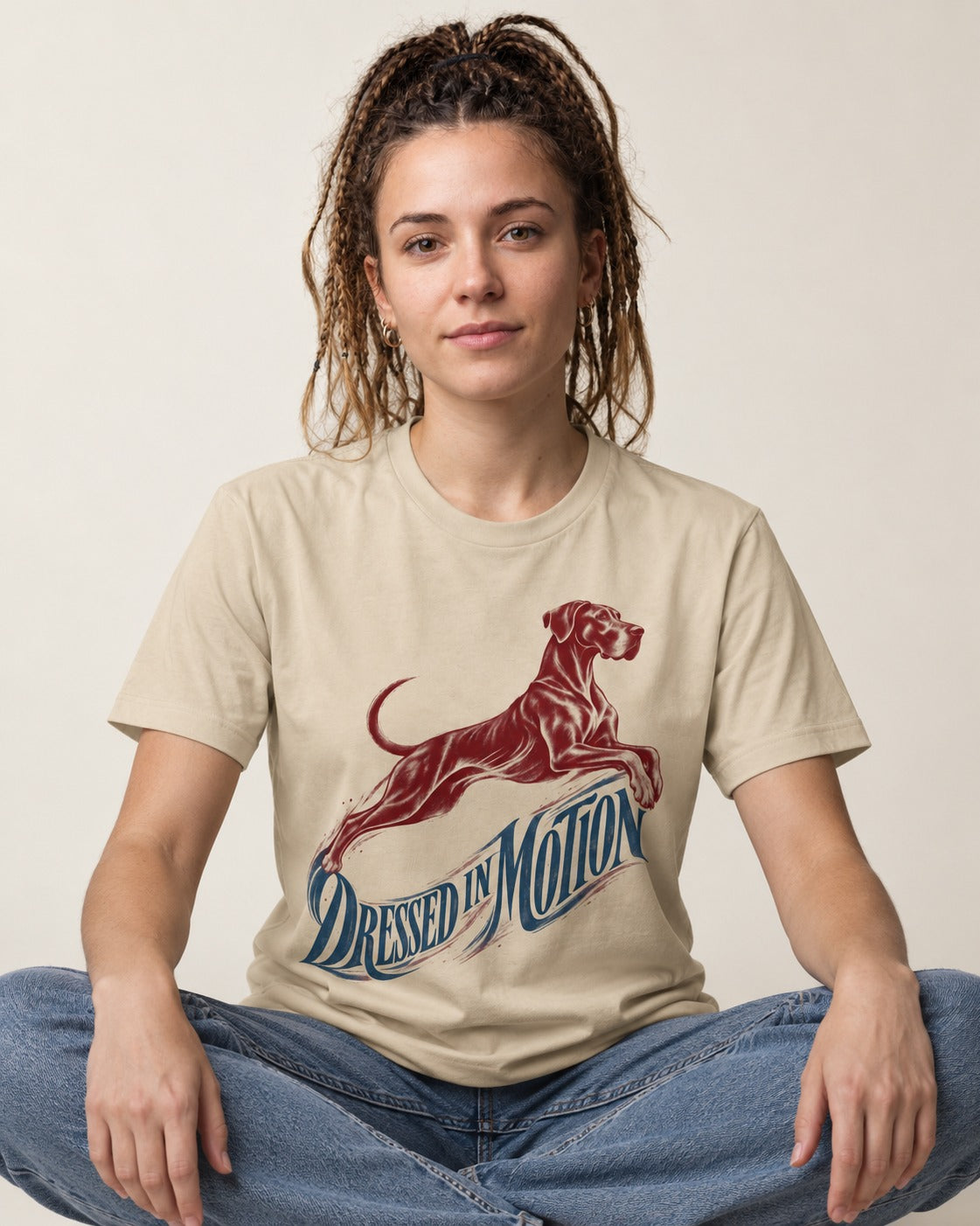 Great Dane Dressed in Motion T-Shirt in Sand, worn by a seated model