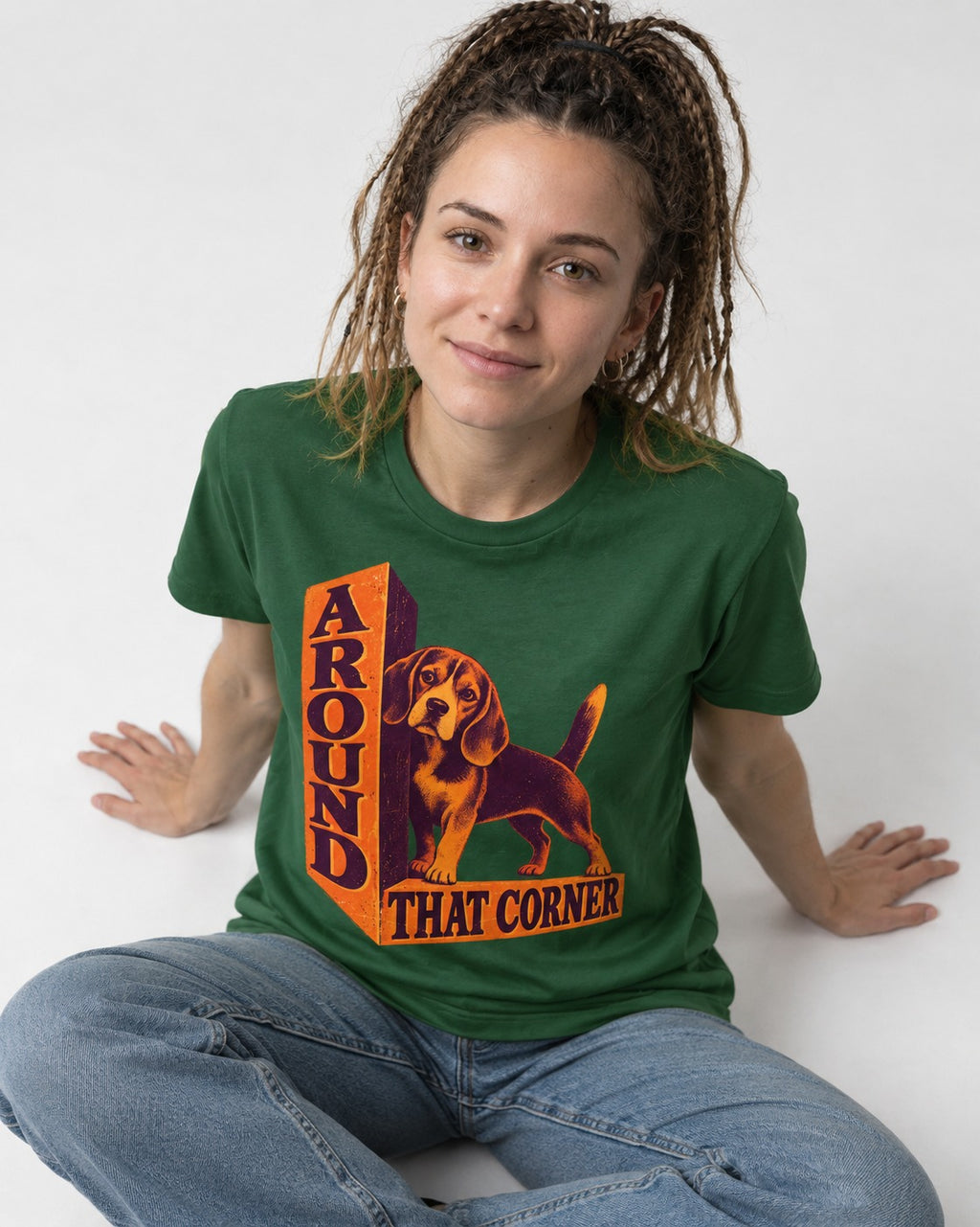 Beagle Around That Corner Graphic T-Shirt in Forest Green, worn by a seated model