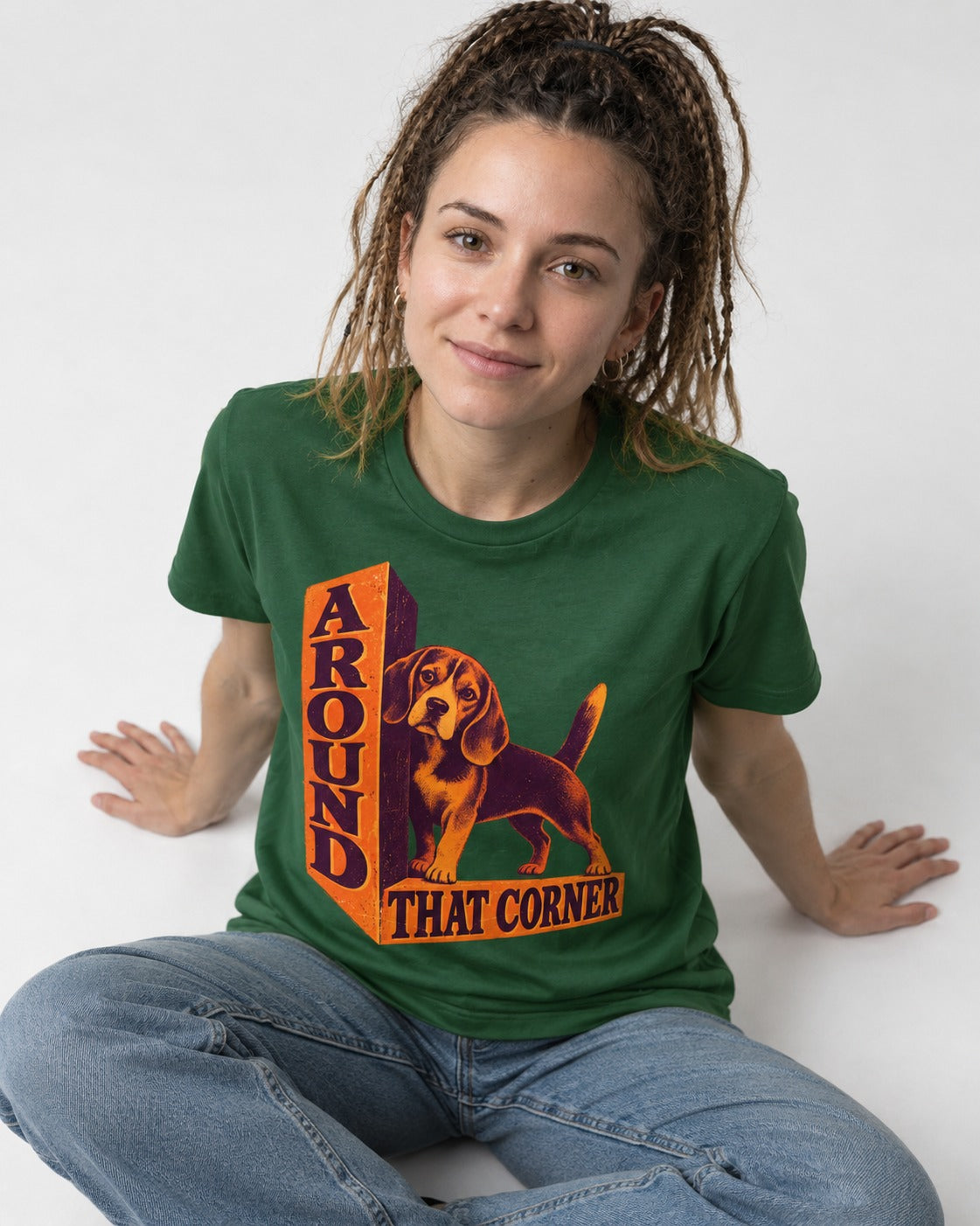 Beagle Around That Corner Graphic T-Shirt in Forest Green, worn by a seated model