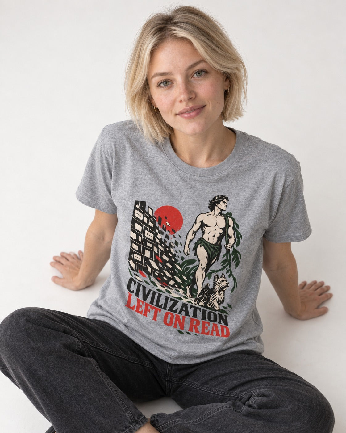 Yorkshire Terrier Left Civilization on Read T-Shirt in Sport Grey, worn by a seated model