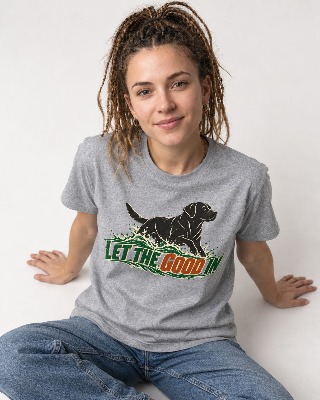 Labrador Retriever Let the Good In T-Shirt in Sport Grey, worn by a seated model