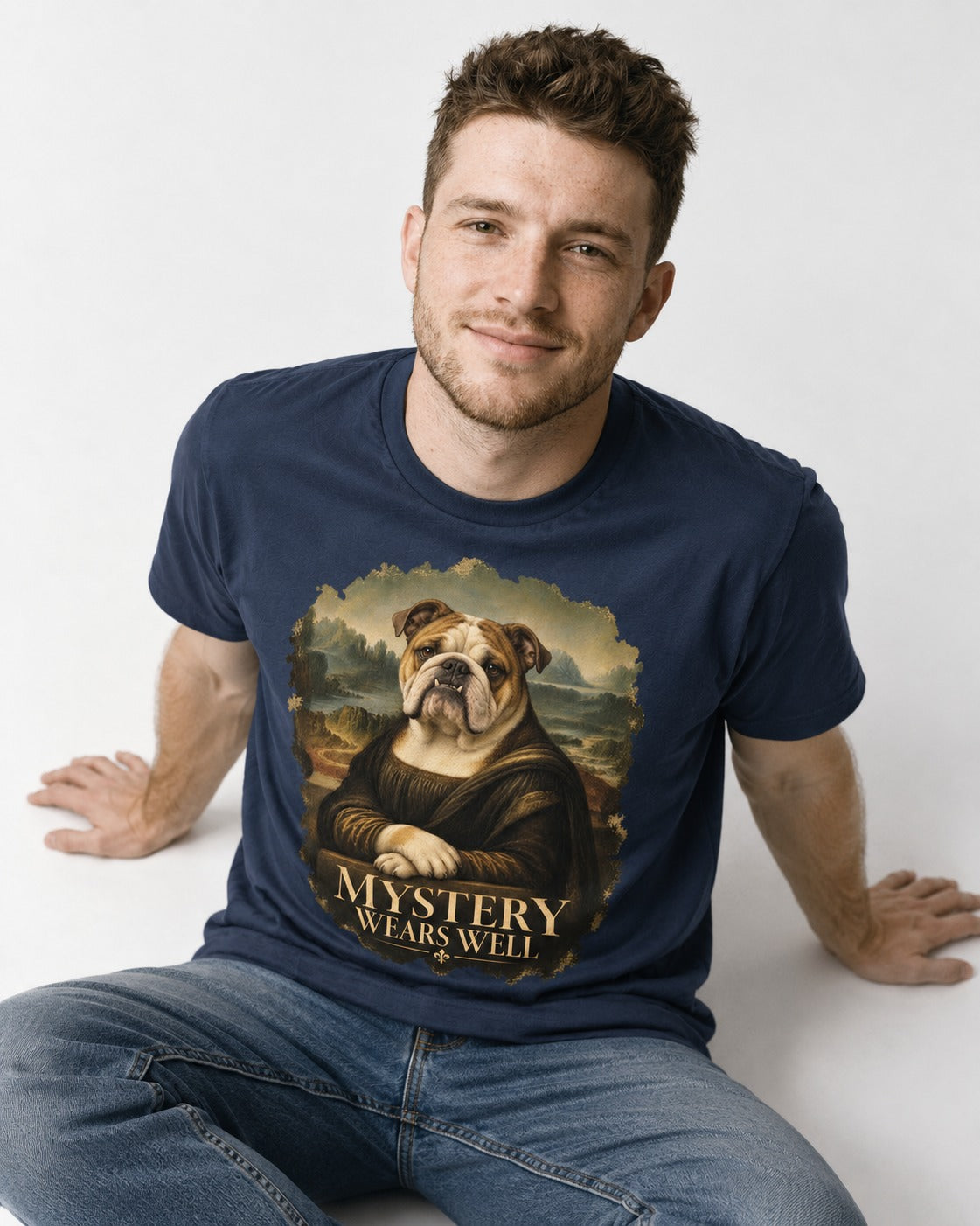 English Bulldog Mystery Wears Well Mona Lisa Portrait T-Shirt in Navy, worn by a seated model