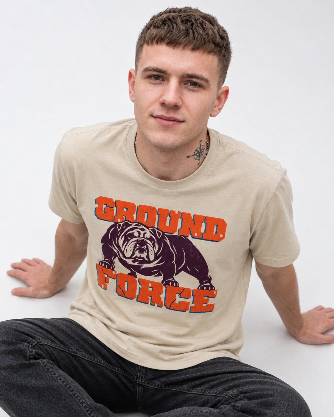 Ground Force English Bulldog T-Shirt in Sand, worn by a seated model