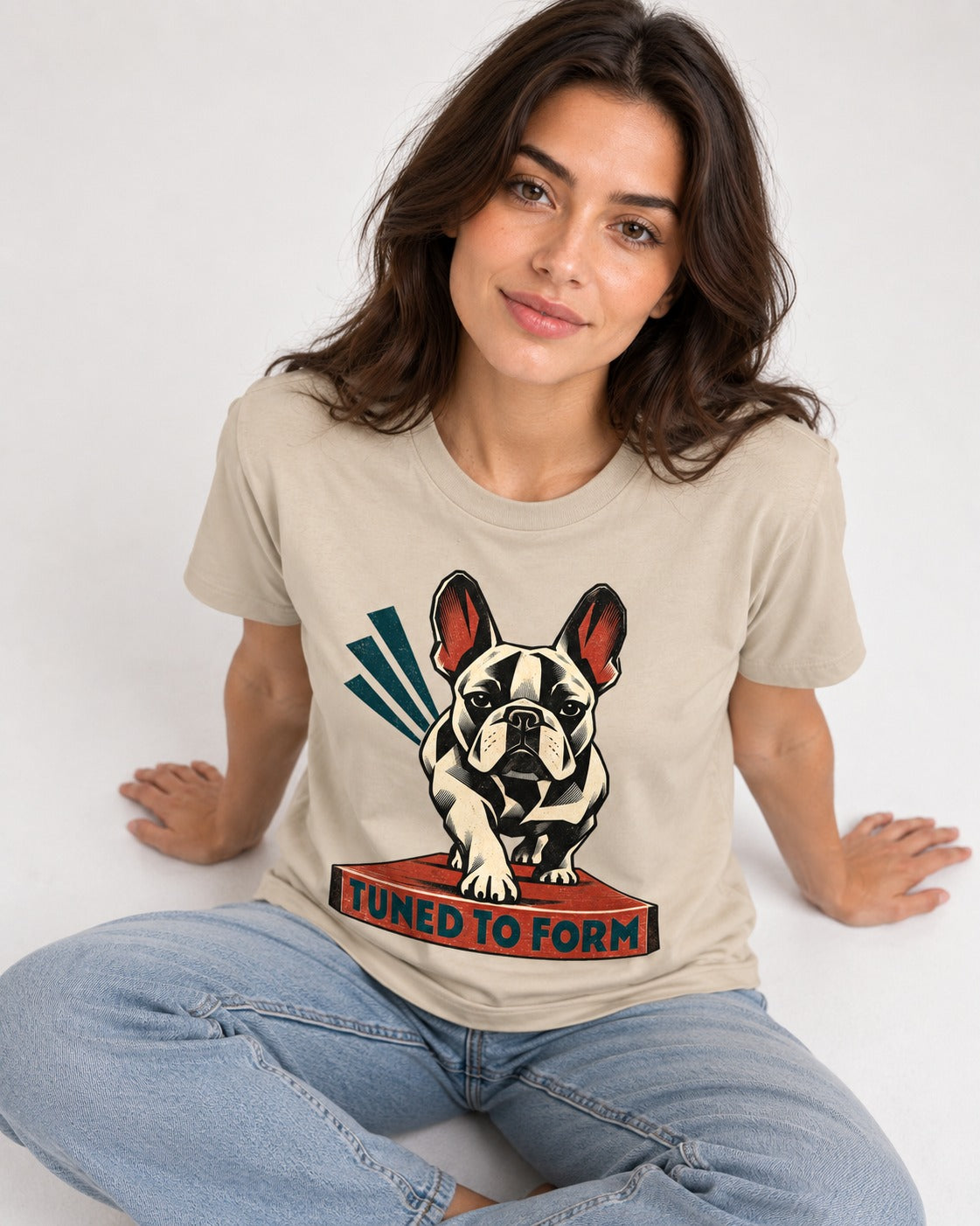 Frenchie Tuned to Form T-Shirt in Sand, worn by a seated model
