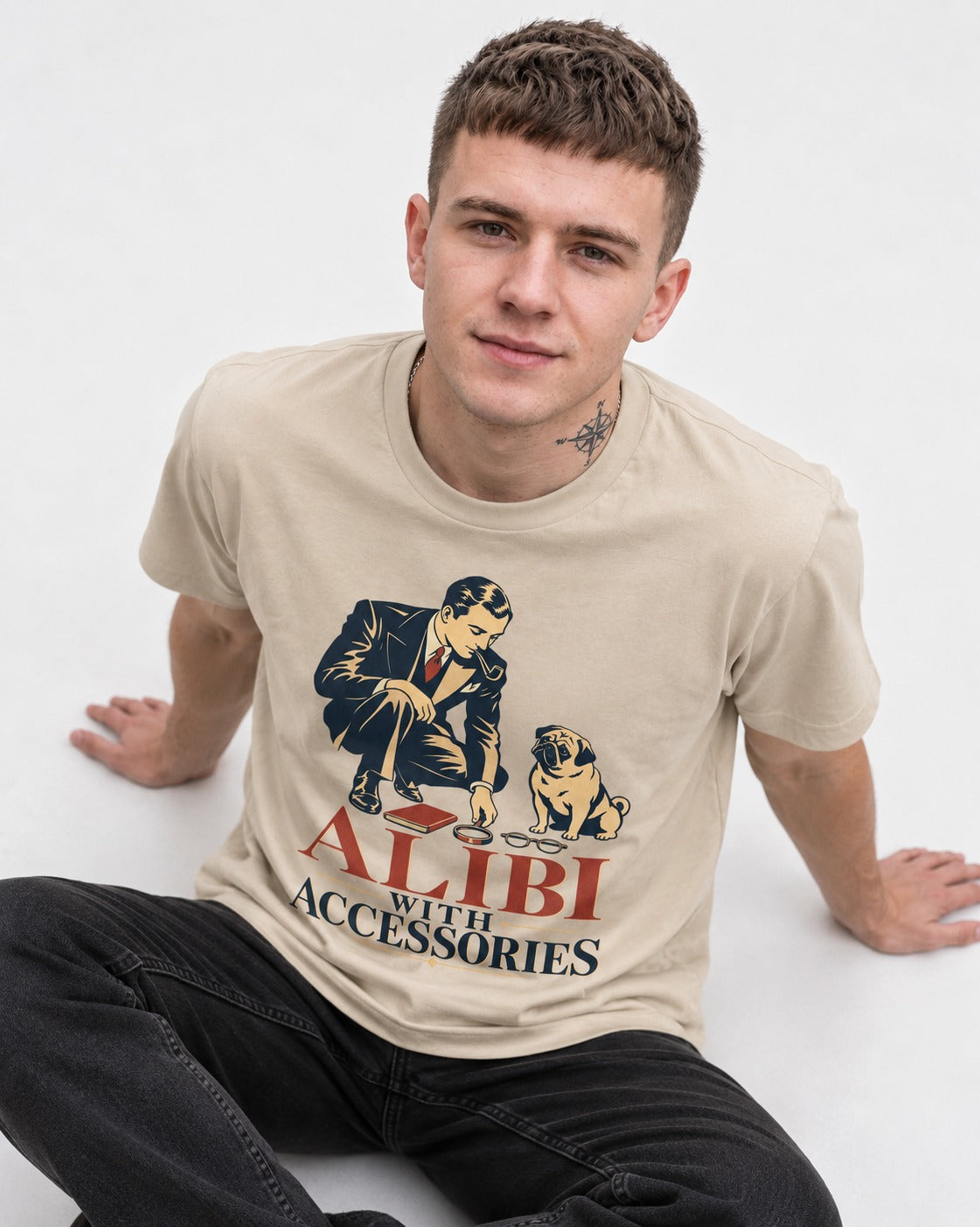 Pug Alibi with Accessories T-Shirt in Sand, worn by a seated model