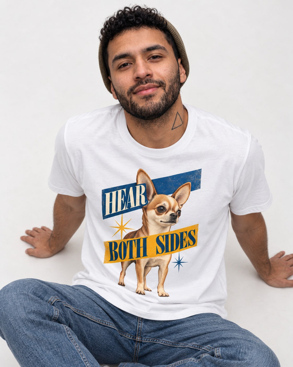 Chihuahua Hear Both Sides Banner Graphic T-Shirt in White, worn by a seated model