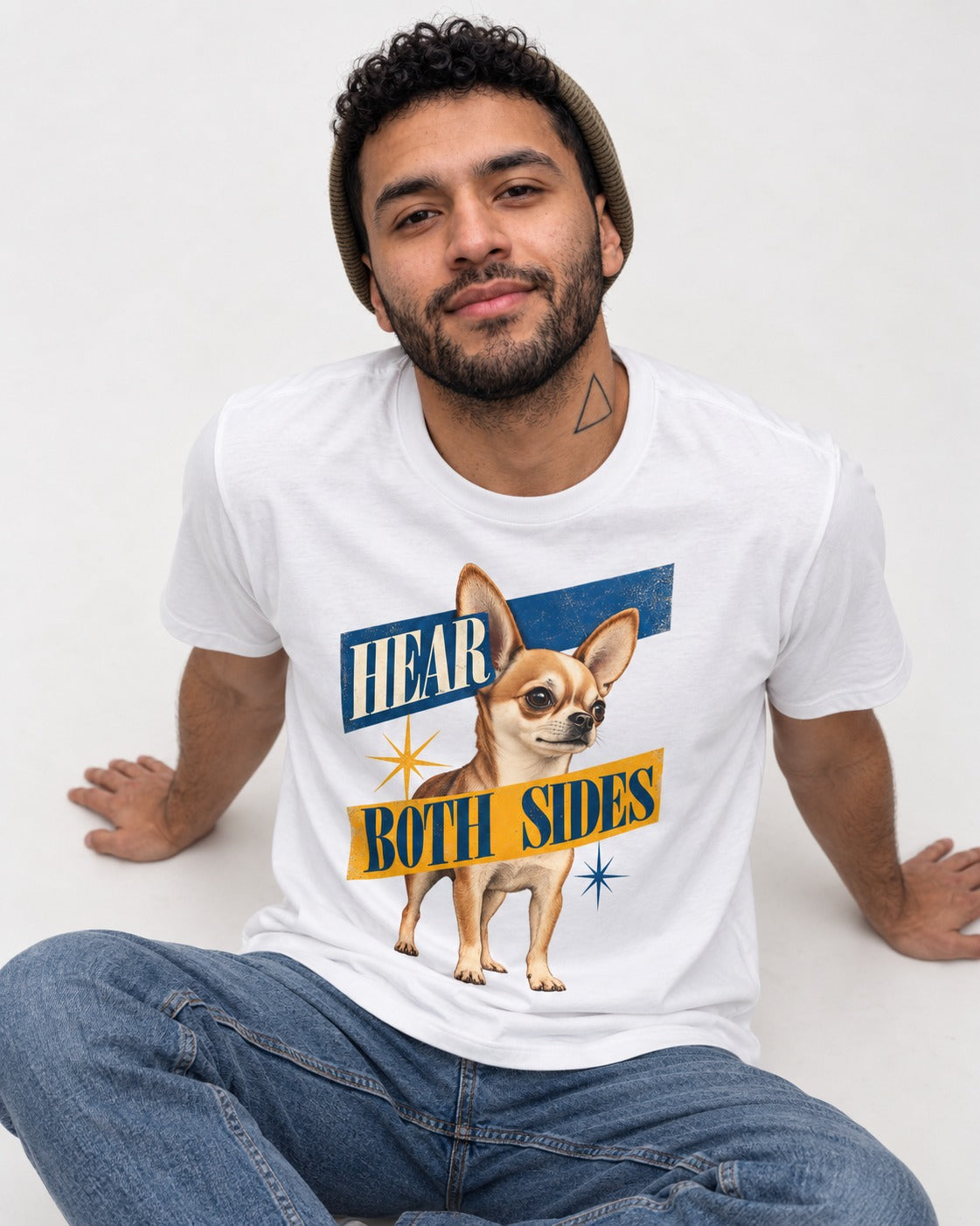 Chihuahua Hear Both Sides Banner Graphic T-Shirt in White, worn by a seated model