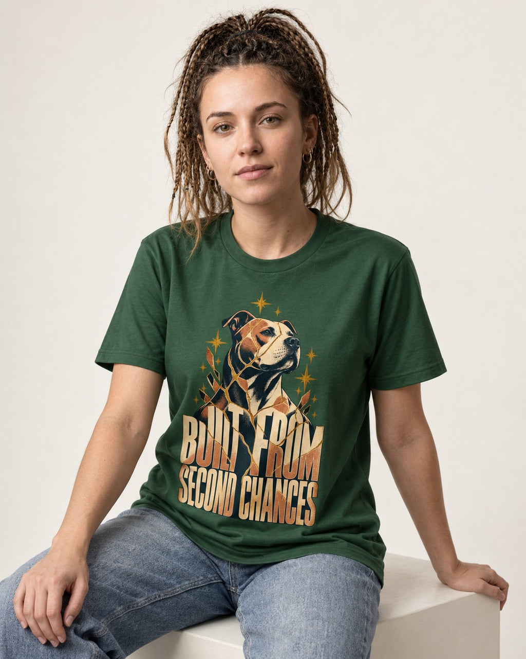 Pitbull Built from Second Chances Kintsugi Graphic T-Shirt in Forest Green, worn by a seated model