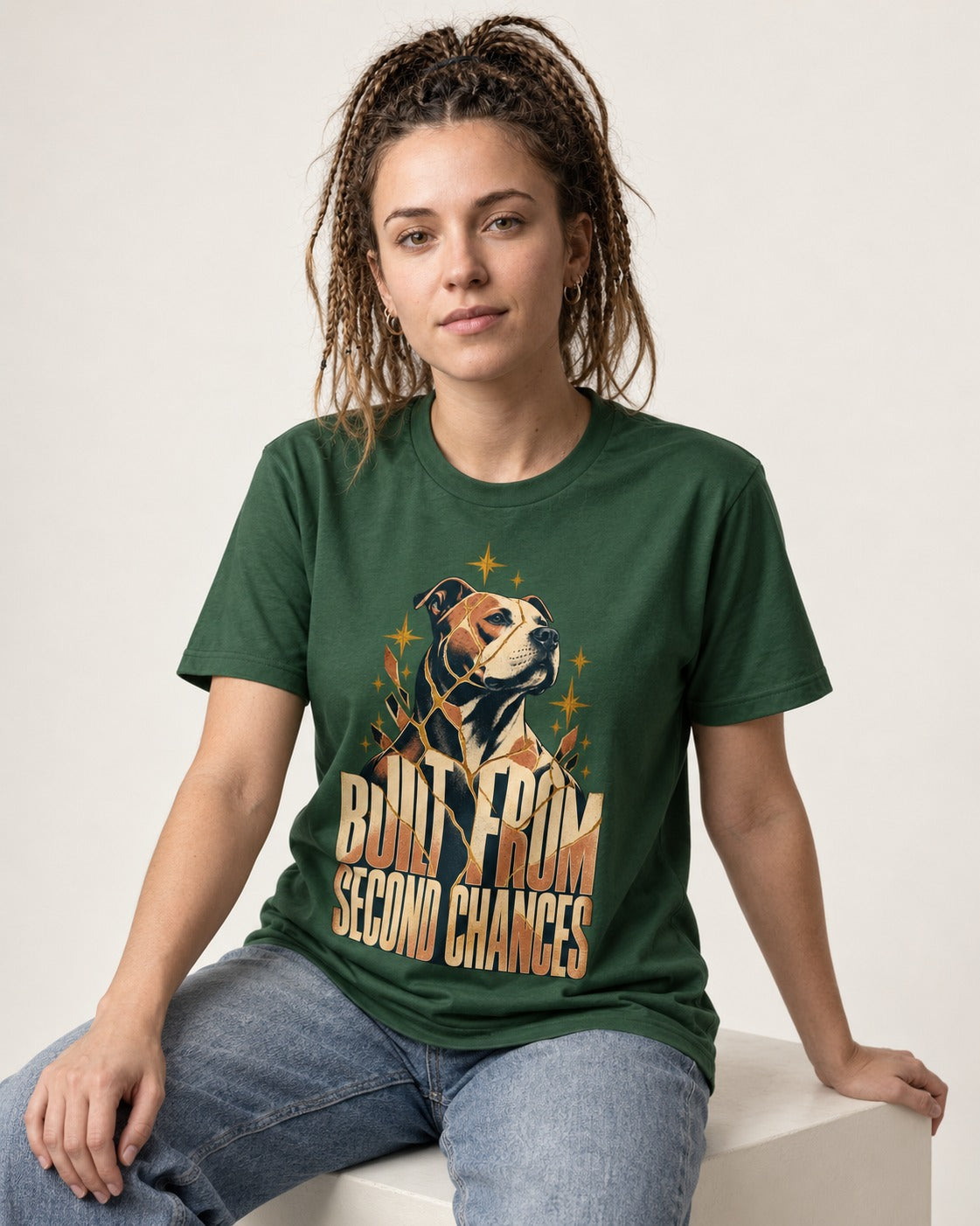 Pitbull Built from Second Chances Kintsugi Graphic T-Shirt in Forest Green, worn by a seated model