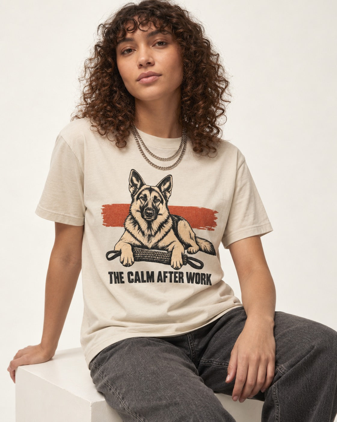 German Shepherd Dog The Calm After Work T-Shirt in Sand, worn by a seated model