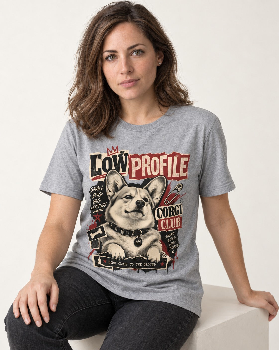 Corgi Low Profile Corgi Club Punk Collage Graphic T-Shirt in Sport Grey, worn by a seated model