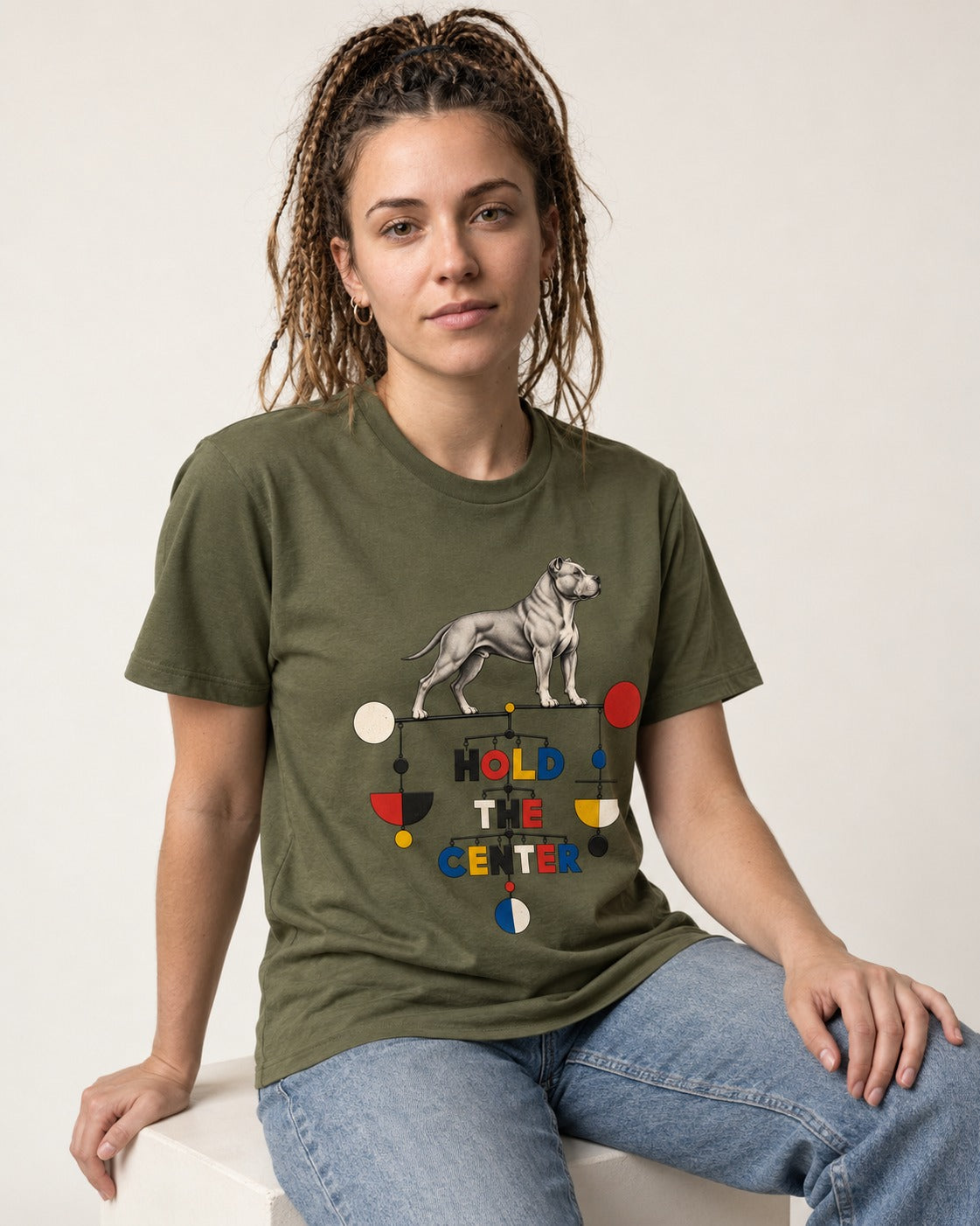 Pitbull Hold the Center Balance Mobile Graphic T-Shirt in Heather Military Green, worn by a seated model