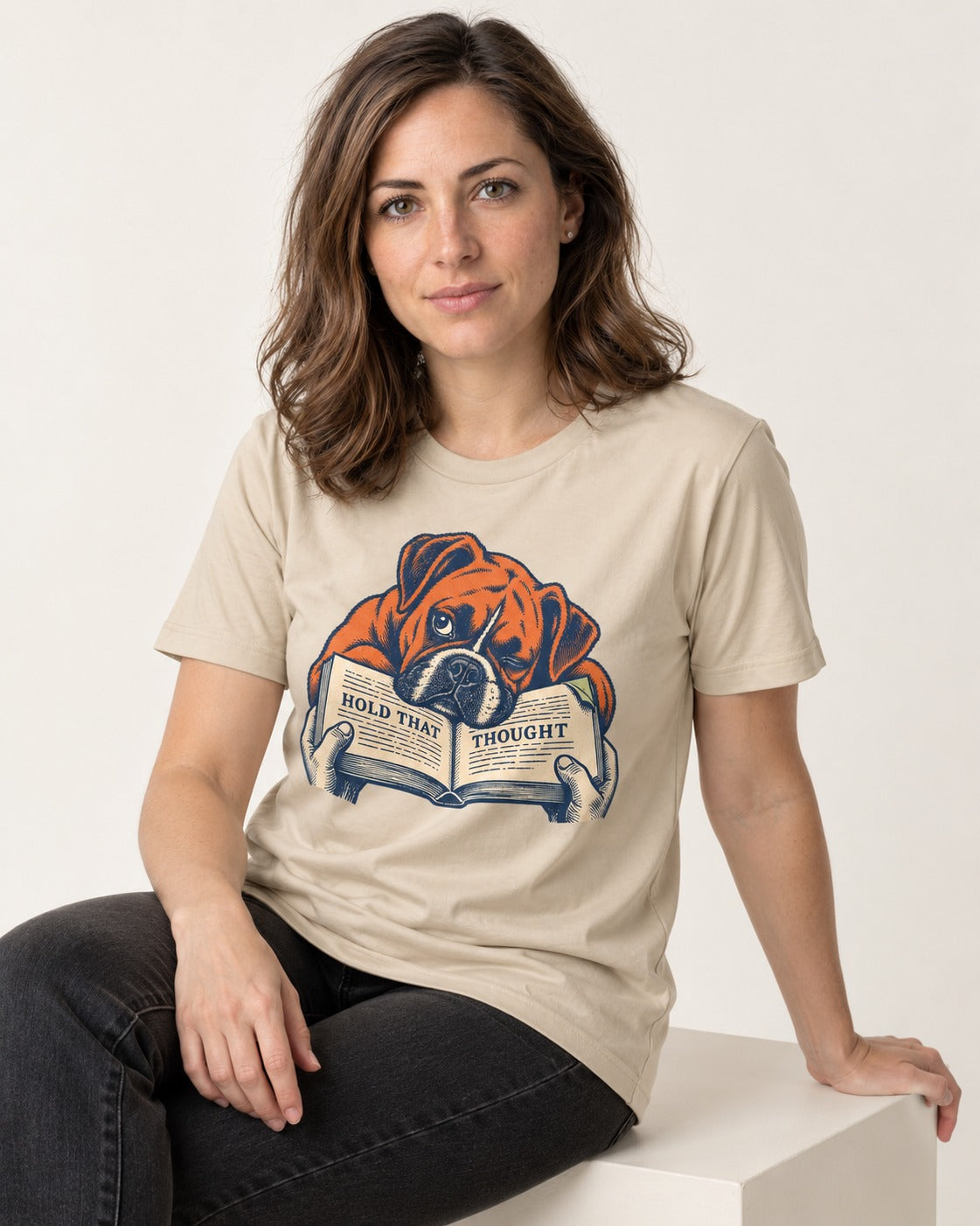 Boxer Hold That Thought T-Shirt in Sand, worn by a seated model