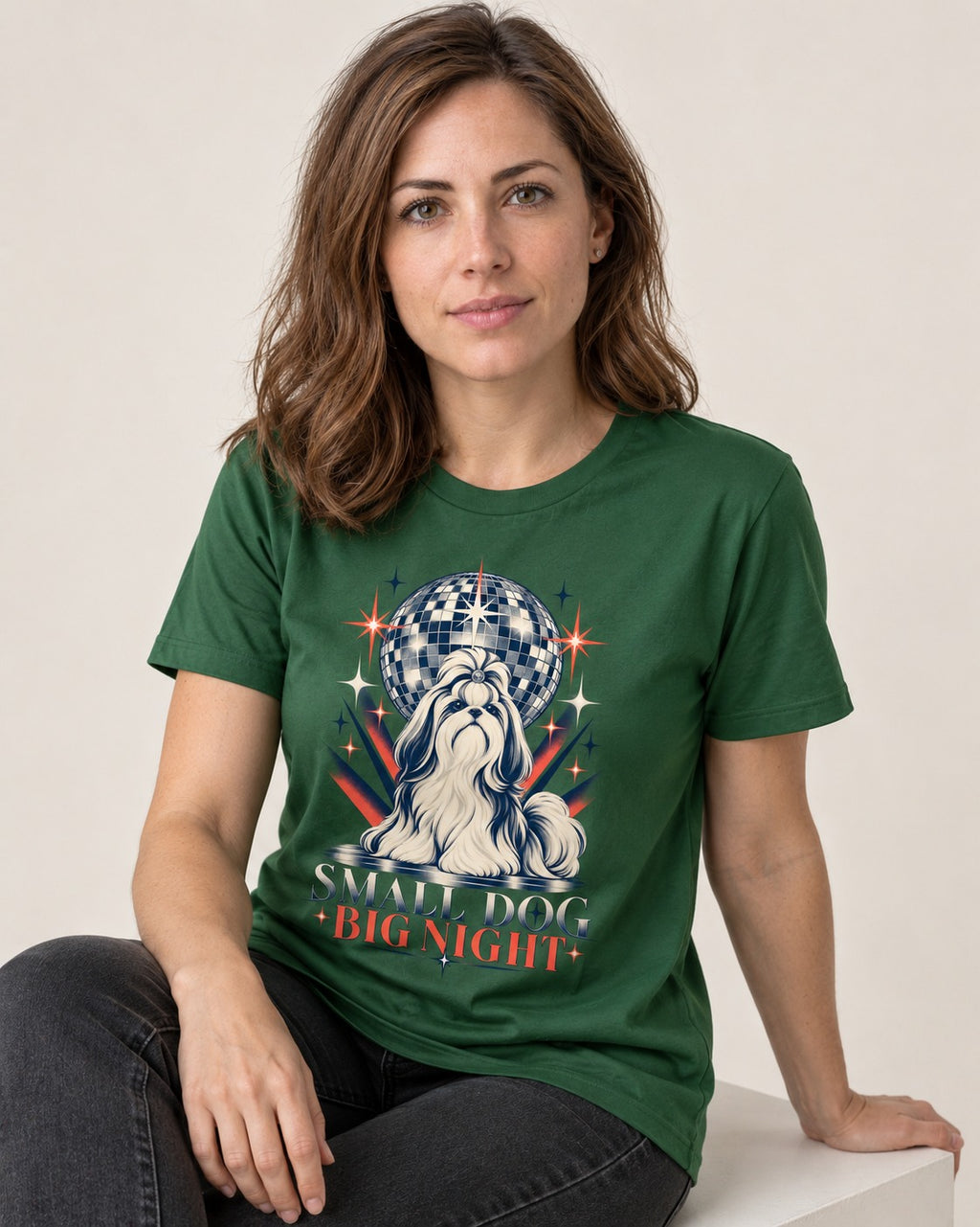 Shih Tzu Small Dog Big Night Disco Graphic T-Shirt in Forest Green, worn by a seated model
