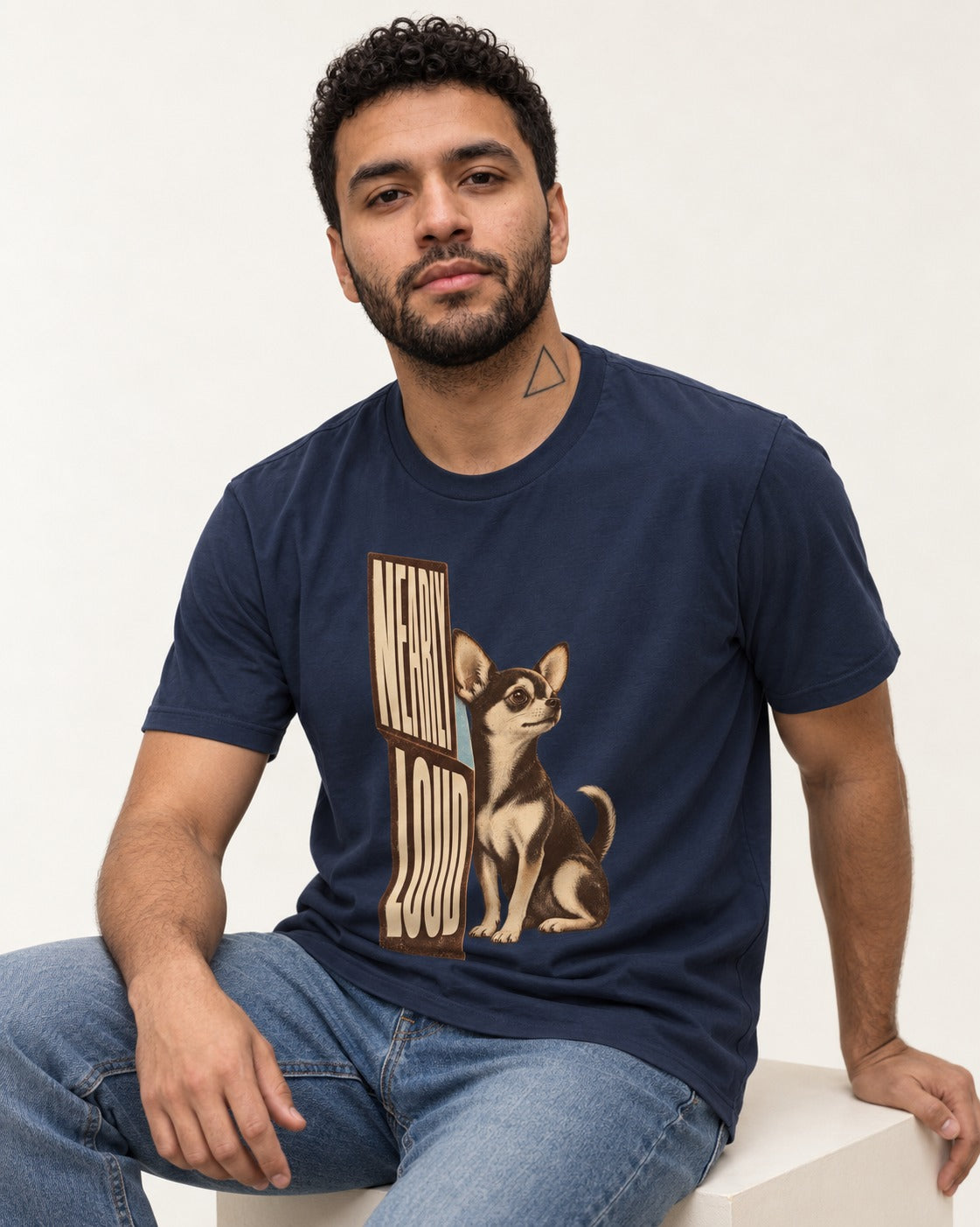 Chihuahua Never Loud T-Shirt in Navy, worn by a seated model