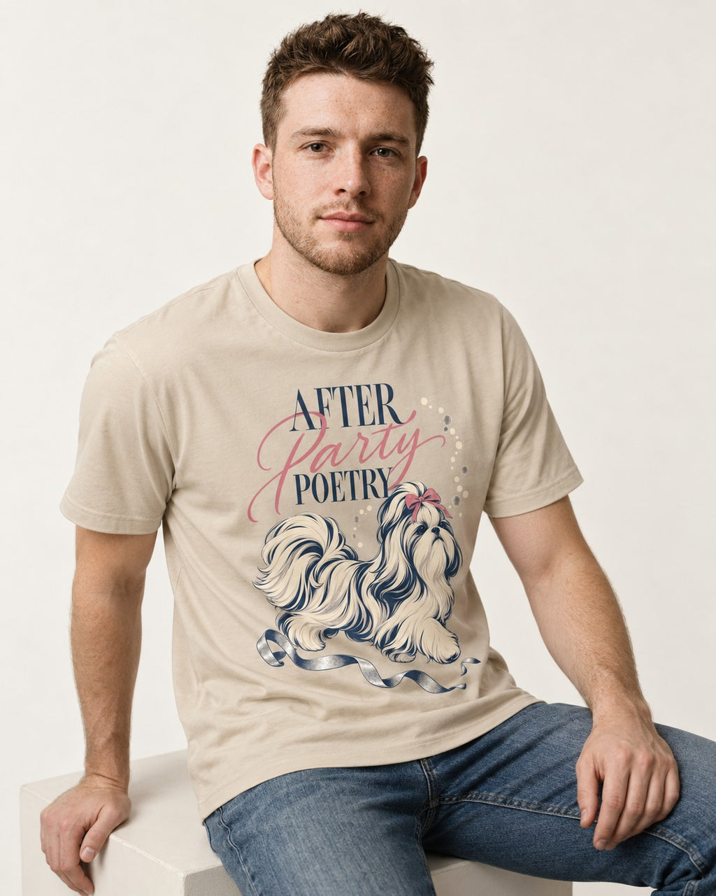 After Party Poetry Shih Tzu T-Shirt in Sand, worn by a seated model