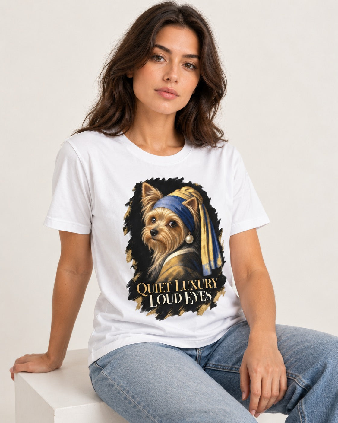Yorkshire Terrier Quiet Luxury Loud Eyes Pearl Portrait Graphic T-Shirt in White, worn by a seated model
