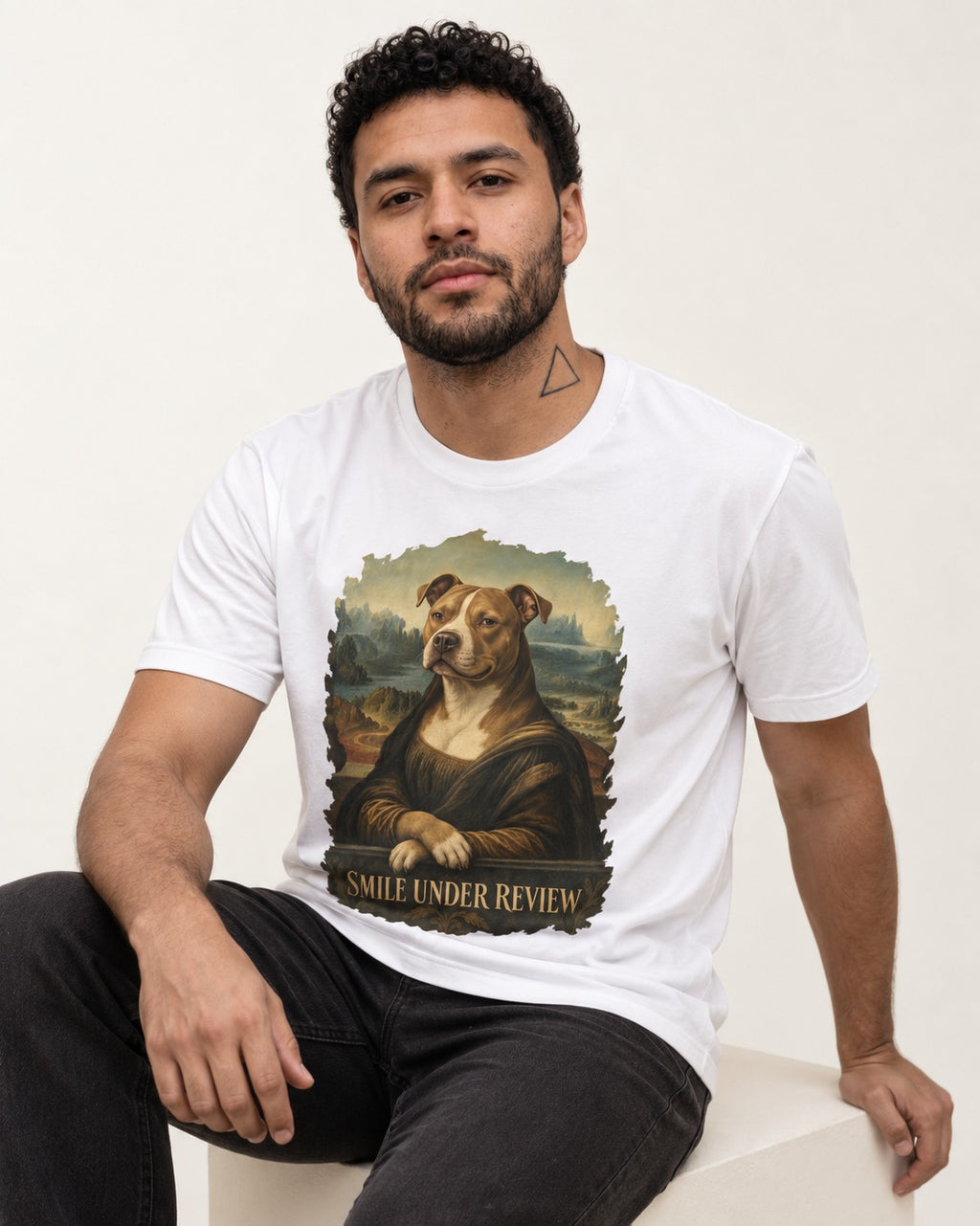 Pitbull Smile Under Review Renaissance Portrait Graphic T-Shirt in White, worn by a seated model