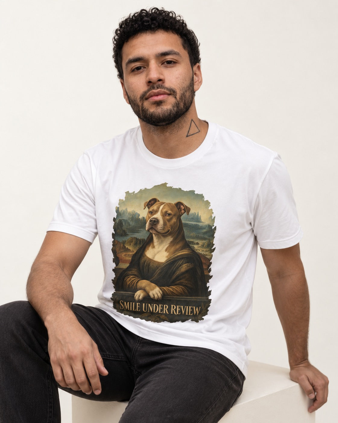 Pitbull Smile Under Review Renaissance Portrait Graphic T-Shirt in White, worn by a seated model