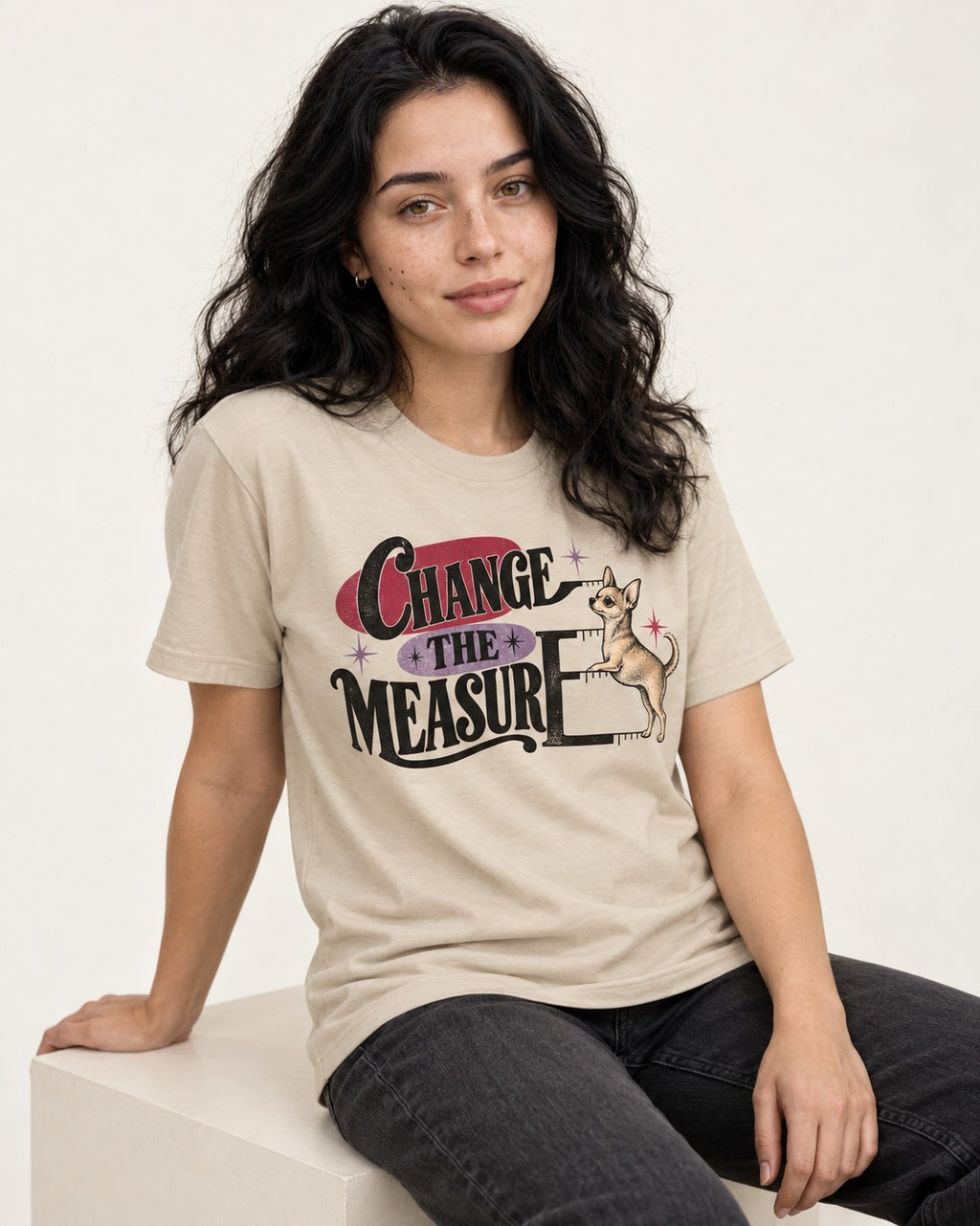 Change the Measure Chihuahua T-Shirt in Sand, worn by a seated model