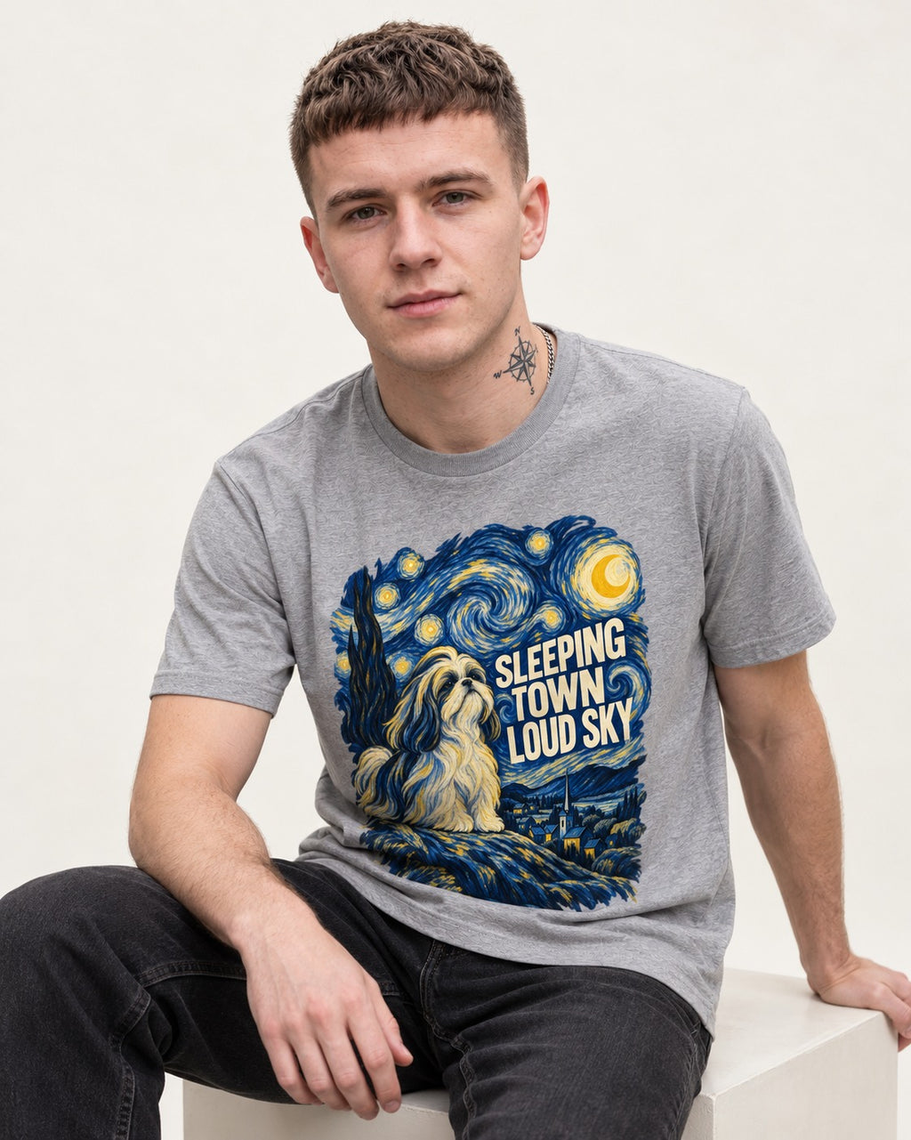 Shih Tzu Sleeping Town Loud Sky Swirling Night Graphic T-Shirt in Sport Grey, worn by a seated model