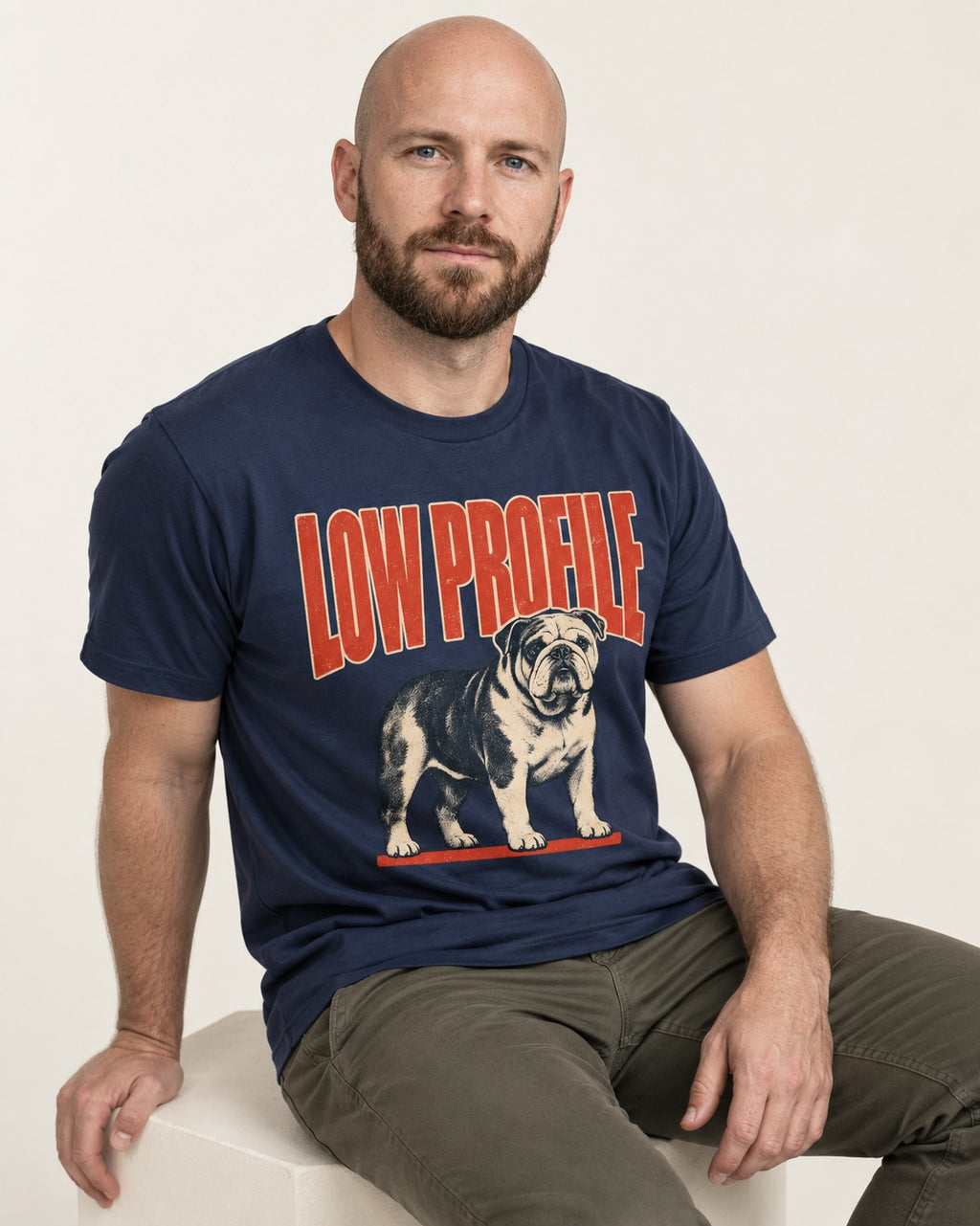 English Bulldog Low Profile Standing Graphic T-Shirt in Navy, worn by a seated model