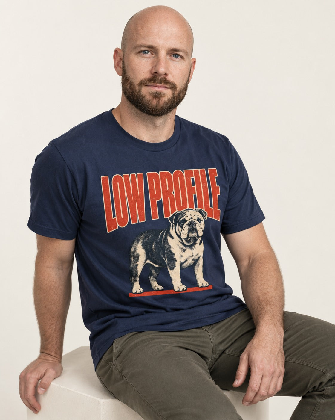 English Bulldog Low Profile Standing Graphic T-Shirt in Navy, worn by a seated model