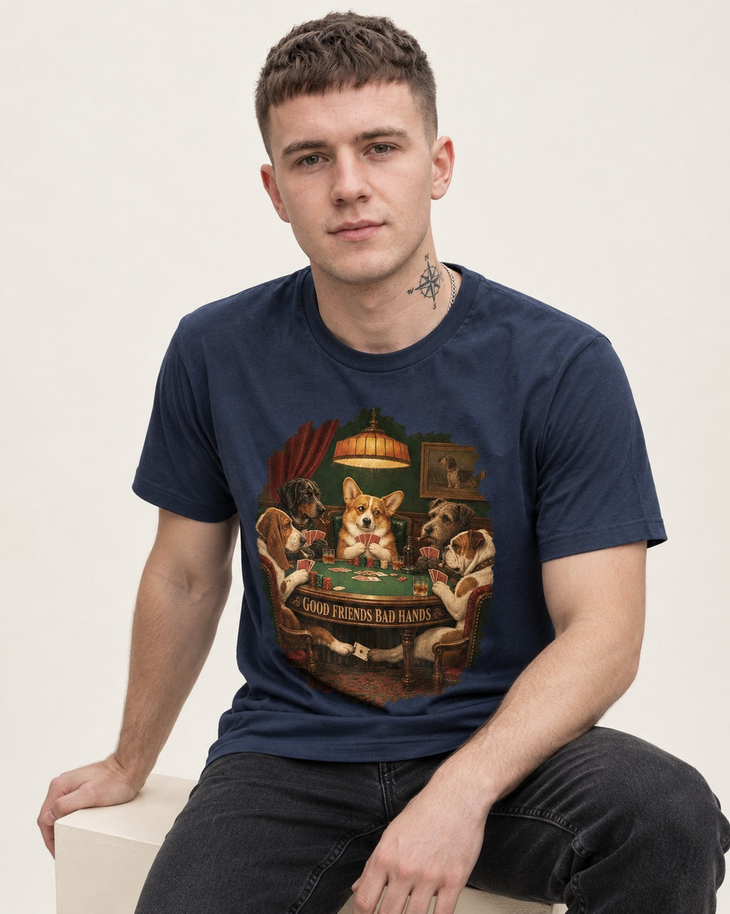 Corgi Good Friends Bad Hands Poker Night T-Shirt in Navy, worn by a seated model