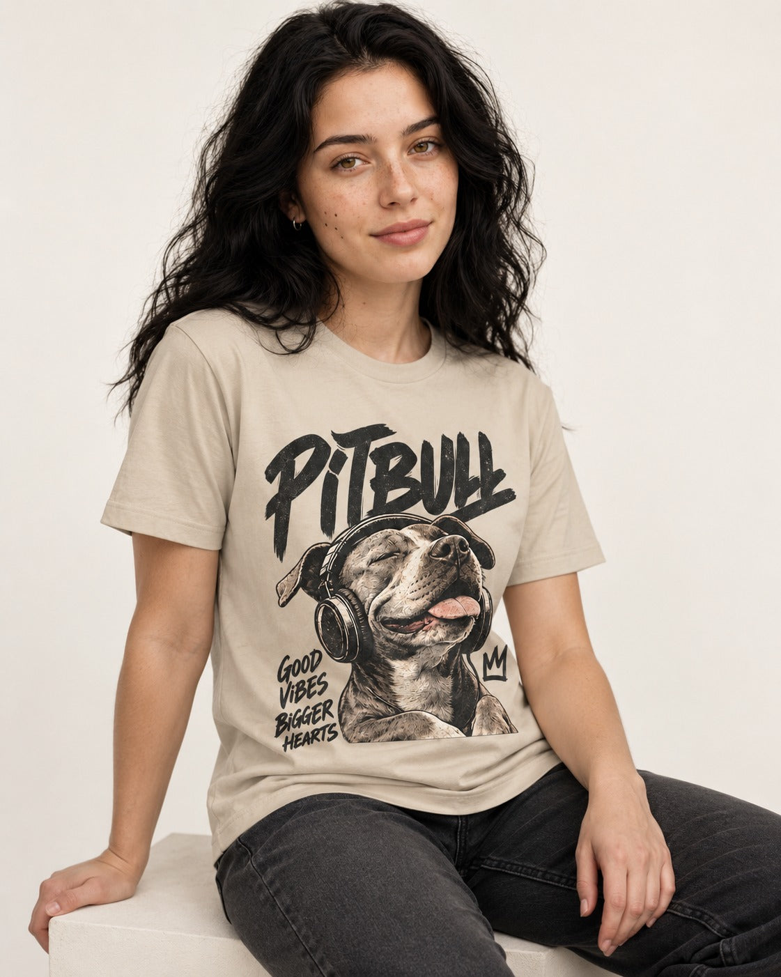 Pitbull Good Vibes Bigger Hearts T-Shirt in Sand, worn by a seated model