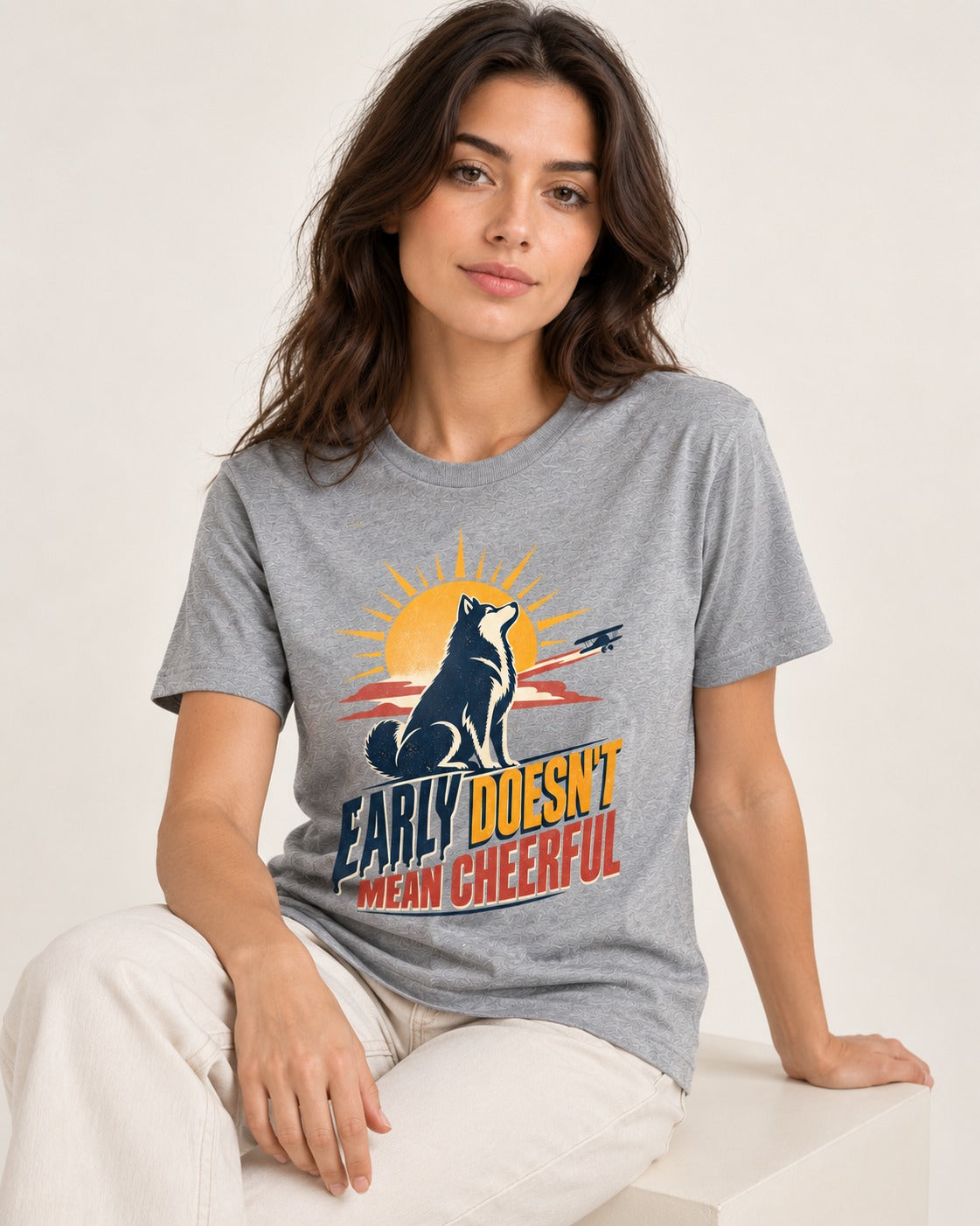 Husky Early Doesnt Mean Cheerful Sunrise Airplane Graphic T-Shirt in Sport Grey, worn by a seated model