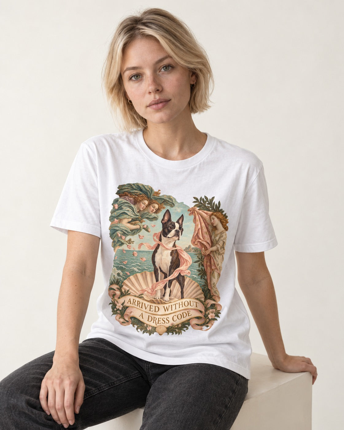 Arrived Without a Dress Code Boston Terrier Venus Parody T-Shirt in White, worn by a seated model