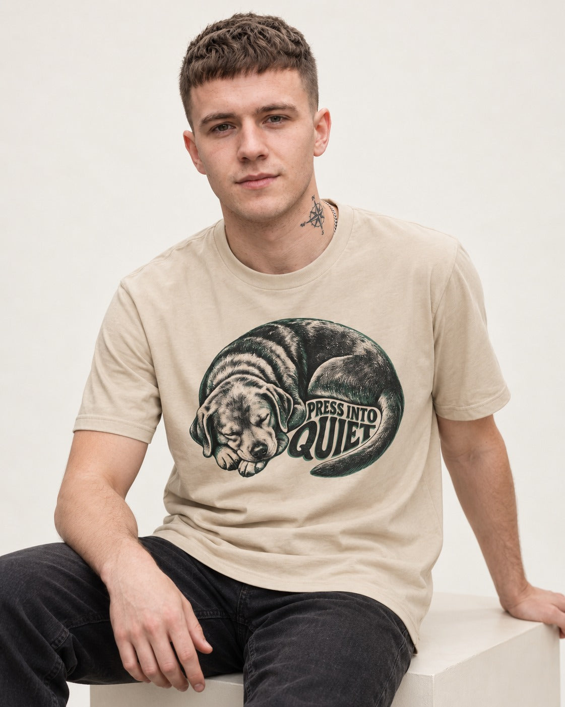 Labrador Retriever Press Into Quiet T-Shirt in Sand, worn by a seated model