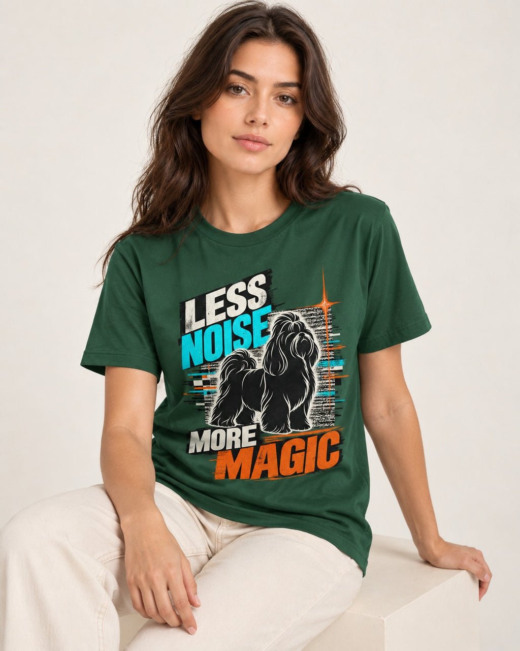 Shih Tzu Less Noise More Magic Pop Art Graphic T-Shirt in Forest Green, worn by a seated model
